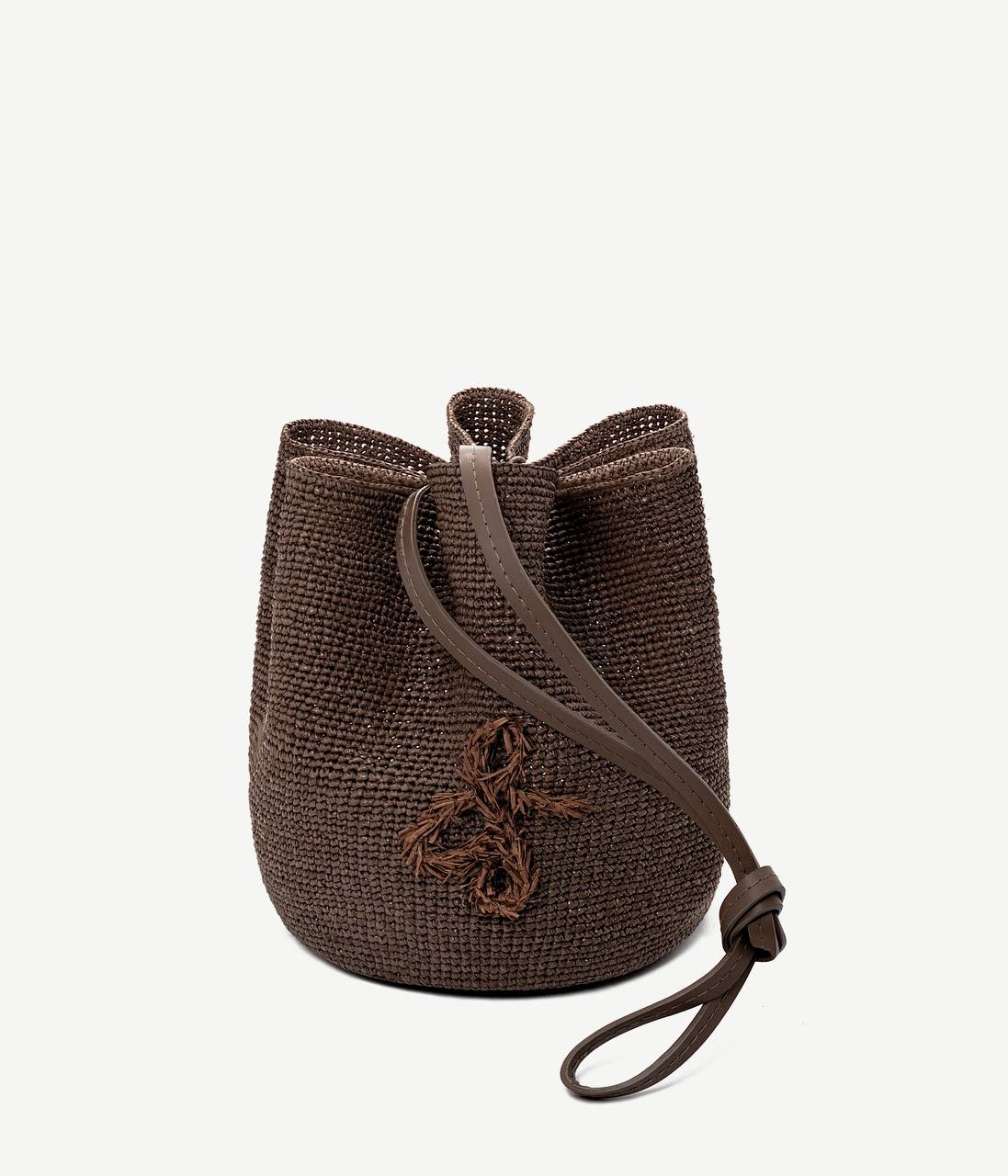 ALLwithoudDIS, Ruslan Baginskiy Brown HatBagThe HatBag is a signature Ruslan Baginskiy silhouette that reflects the brand’s evolution, shaped by over eight years of craftsmanship in headwear.A functional transformer, the HatBag can be worn as a headpiece or carried as a bag using the long leather strap. Crafted from brown paper raffia — an eco-friendly, lightweight, and textured material. Finished with a hand-embroidered monogram. Easy to wear and style.Handcrafted in Ukraine.