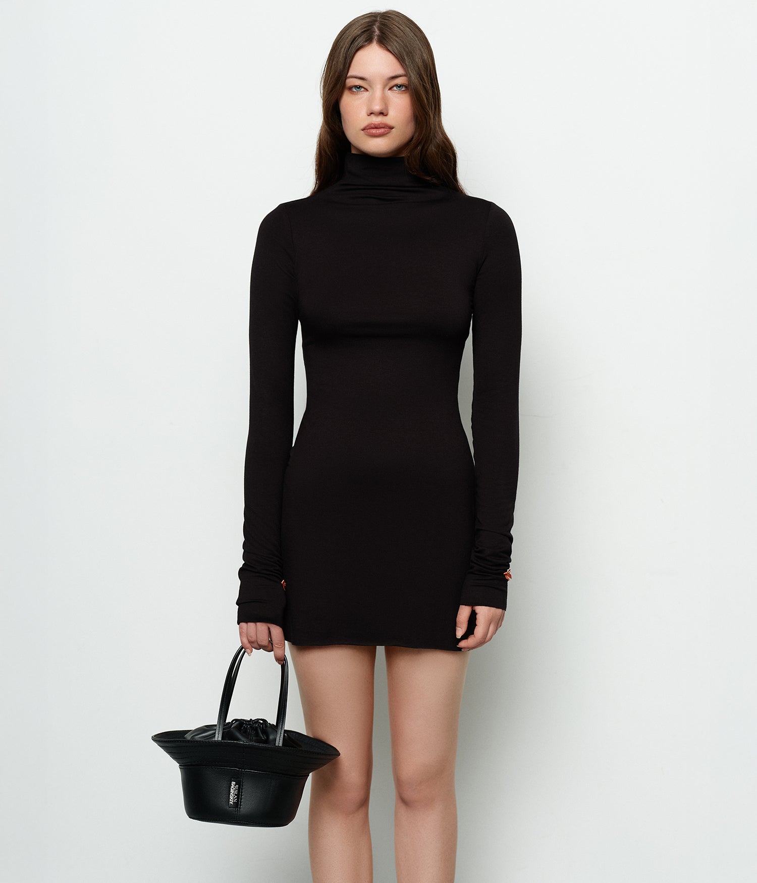 Hats, Ruslan Baginskiy Mini Bucket Hat BagThe bag resembles a hat and is crafted from black leather that holds its shape well. It features leather handles for comfortable carrying on the shoulder or by hand. The interior includes a leather pouch for the safe storage of belongings, and the bag is finished with the Ruslan Baginskiy logo on the side. Handmade in Ukraine.