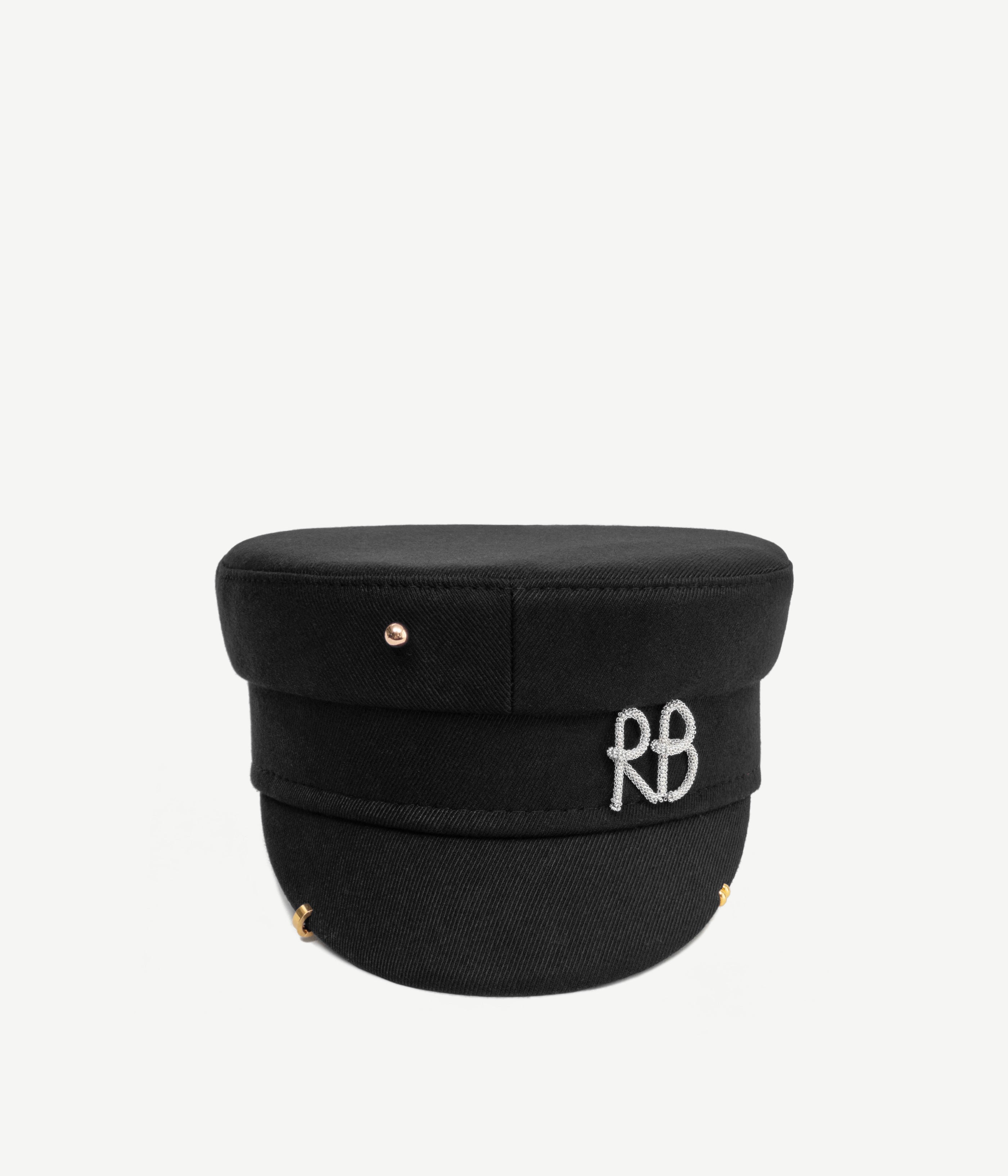 ALLwithoudDIS, Ruslan Baginskiy Black Cotton Baker Boy Cap with PiercingA signature shape of the brand, made from natural black cotton. The clean-cut geometry of the baker boy cap is complemented by standout details: a piercing and a silver metal RB logo.Handcrafted in Ukraine.