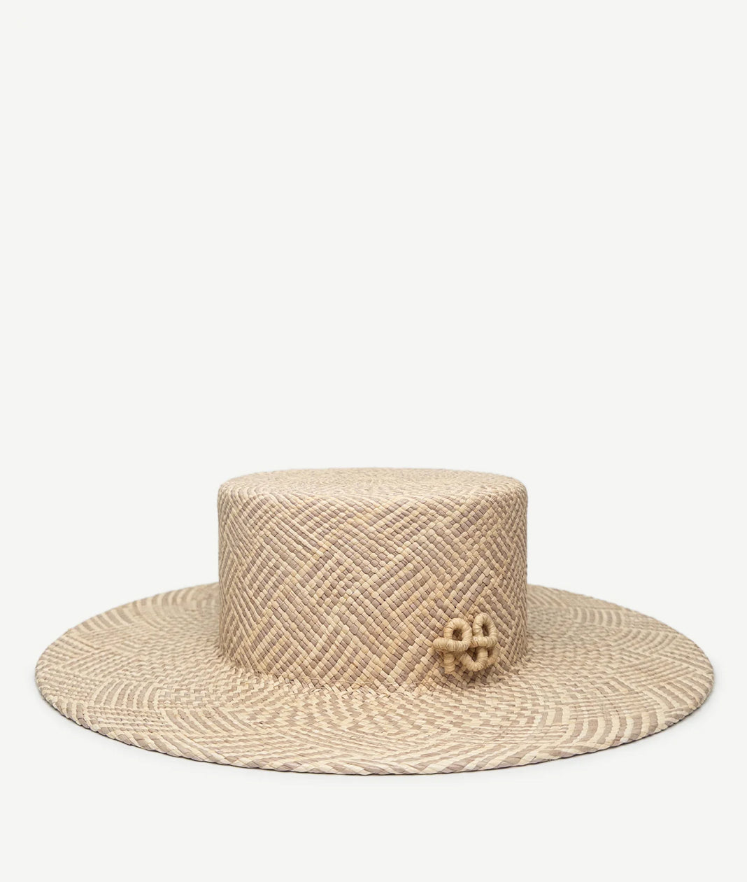 Canotier Hat, Ruslan Baginskiy Canotier HatThe hat is crafted from tightly woven natural beige straw that holds its shape well and features a checkered-stripe weave pattern. Its flat crown and even brim create a geometric silhouette, adding definition and a stylish accent. Finished with a handcrafted RB monogram.Handmade in Ukraine.