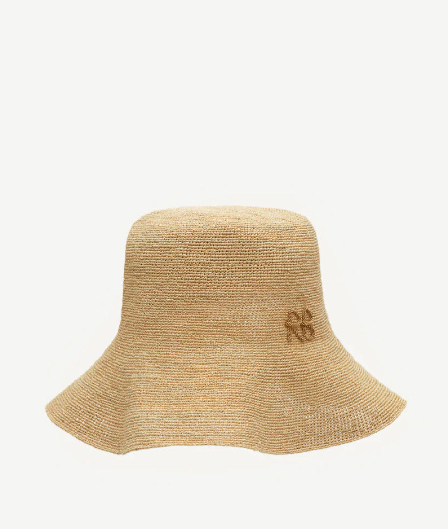 ALLwithoudDIS, Ruslan Baginskiy Soft Straw Bucket HatThe bucket hat is crafted from natural straw. Its soft, fluid shape is complemented by the texture of the organic material. Densely woven, it is finished with the RB monogram.Handcrafted in Ukraine.