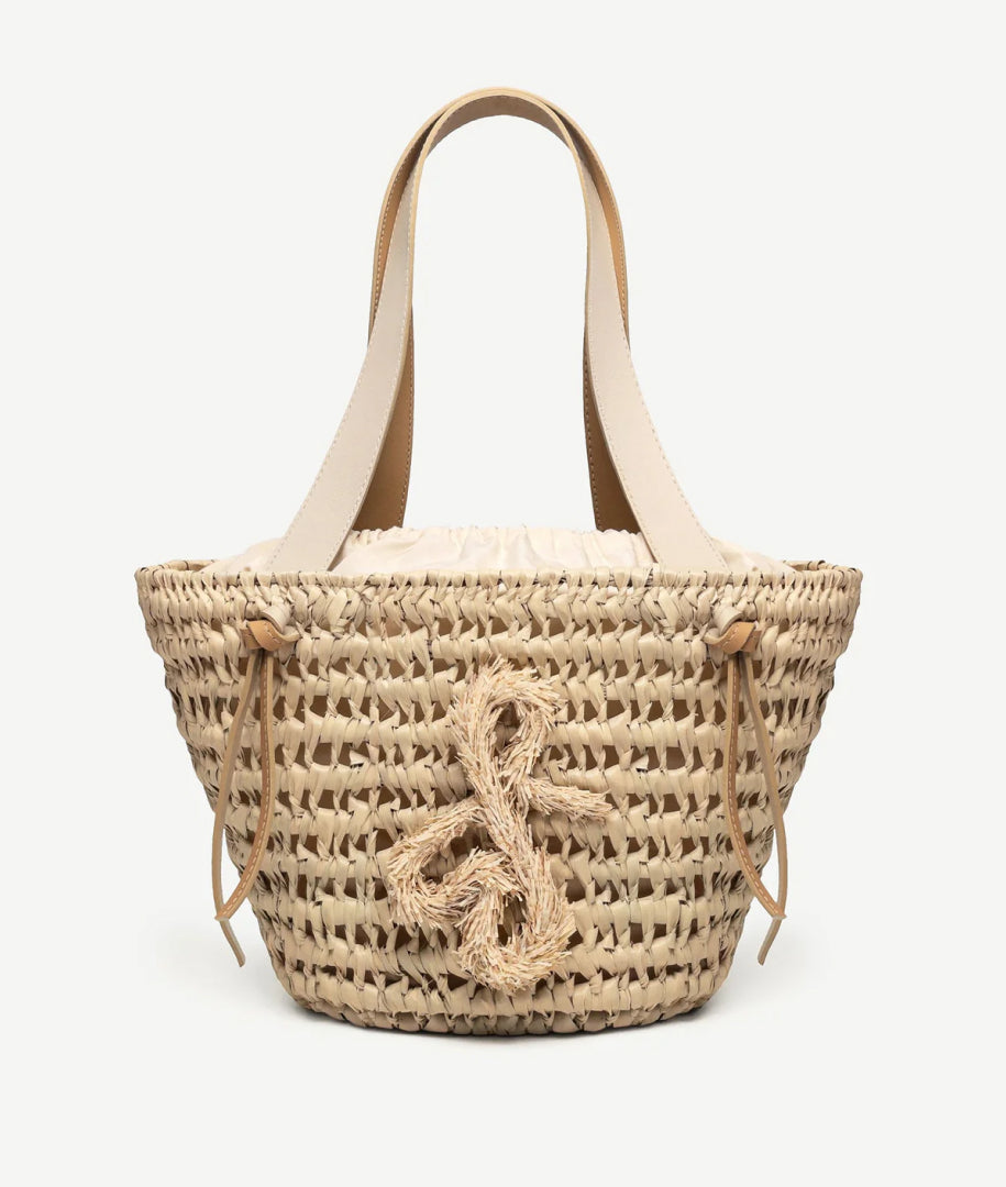 ALLwithoudDIS, Ruslan Baginskiy Corn Tote Bag made of StrawCrafted using traditional Ukrainian weaving techniques with corn leaves. The material is Madagascan straw. The woven texture features double handles and is complemented by a cotton drawstring pouch with a hand-embroidered RB monogram.Handcrafted in Ukraine.
