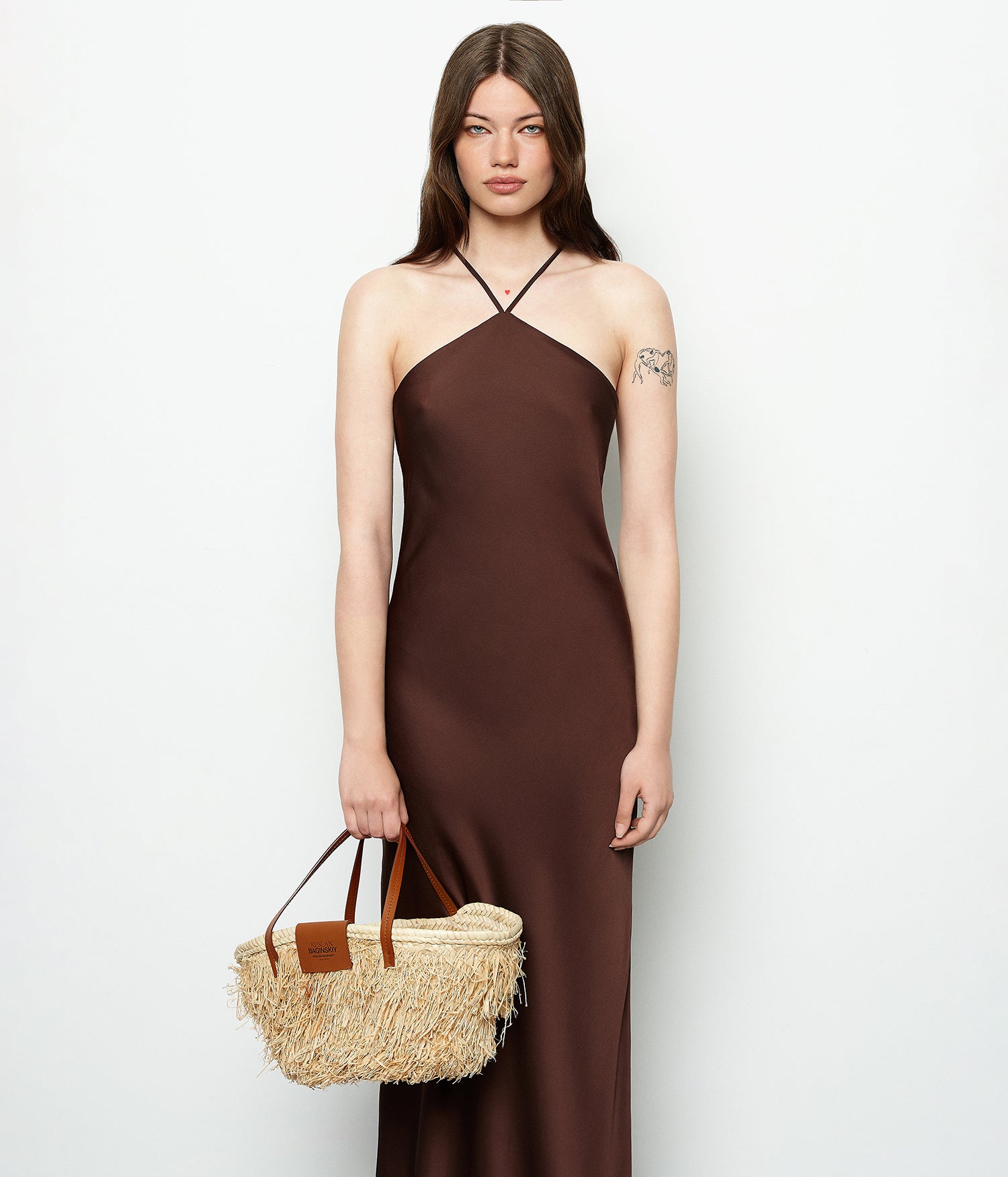 Mother’s Day Gifts, Ruslan Baginskiy "Nest" Tote BagThis bag is crafted from tightly woven natural straw, giving it a structured and durable shape. Featuring brown leather handles, it can be comfortably carried on the shoulder or by hand. The interior includes a cotton pouch to keep your essentials safe, and the bag is finished with the Ruslan Baginskiy logo for a signature touch.Handmade in Ukraine.